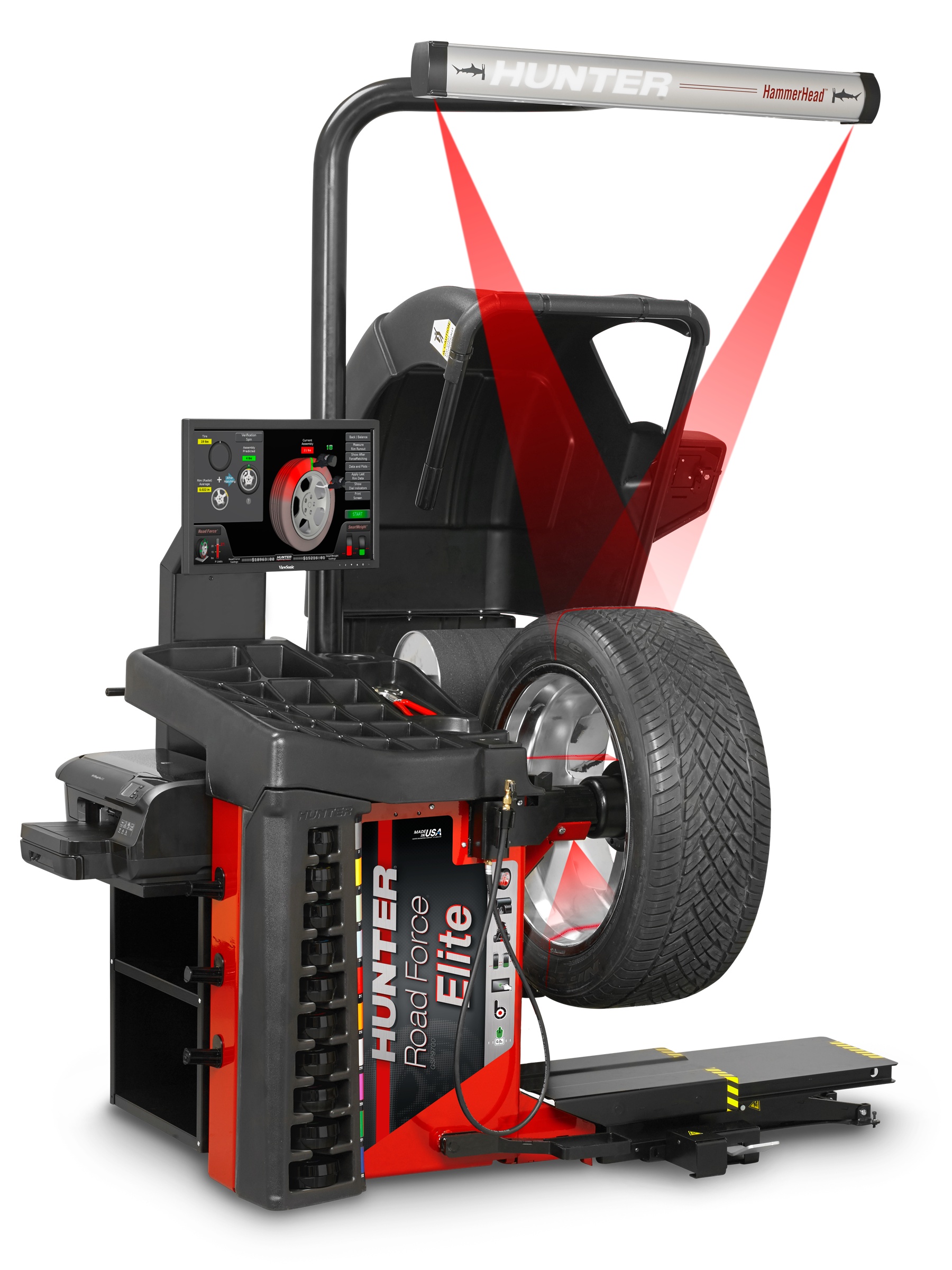 A red and black wheel balancer with a red laser line across the wheel mount